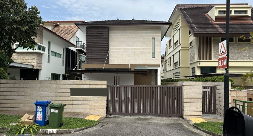 Modern house with brown gate and light facade.