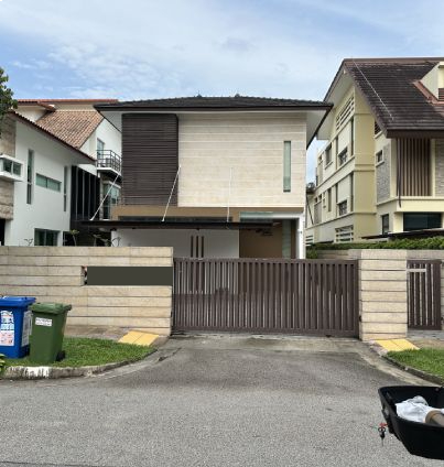 Modern house with brown gate and light facade.