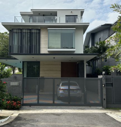 Modern house with grey gate and greenery.